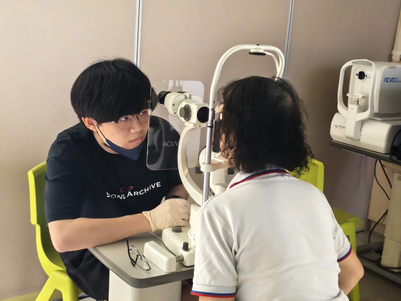 Eye screening in progress during the JCI Queensway community development activity on 19 May 2026.