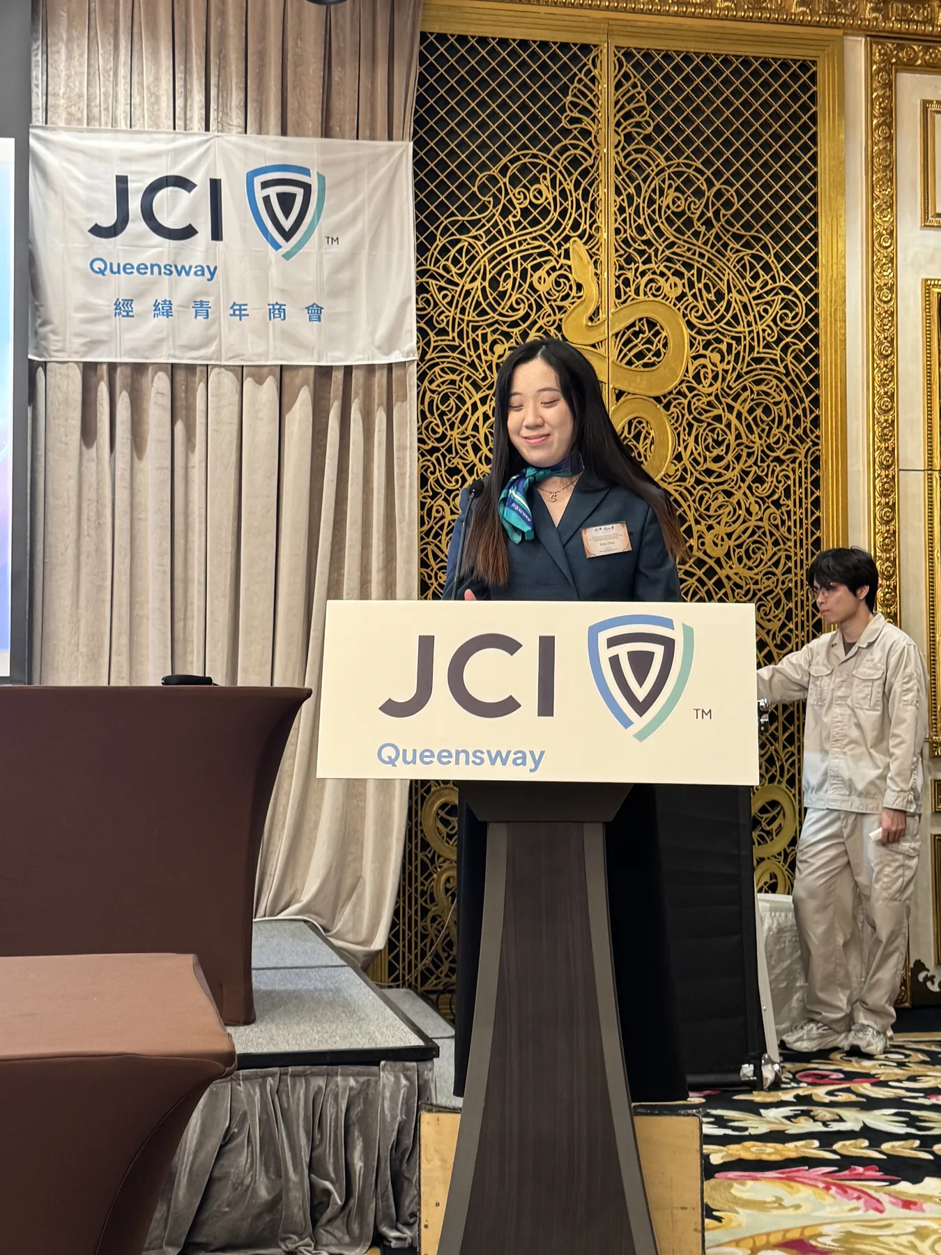 A member at the JCI Queensway podium.