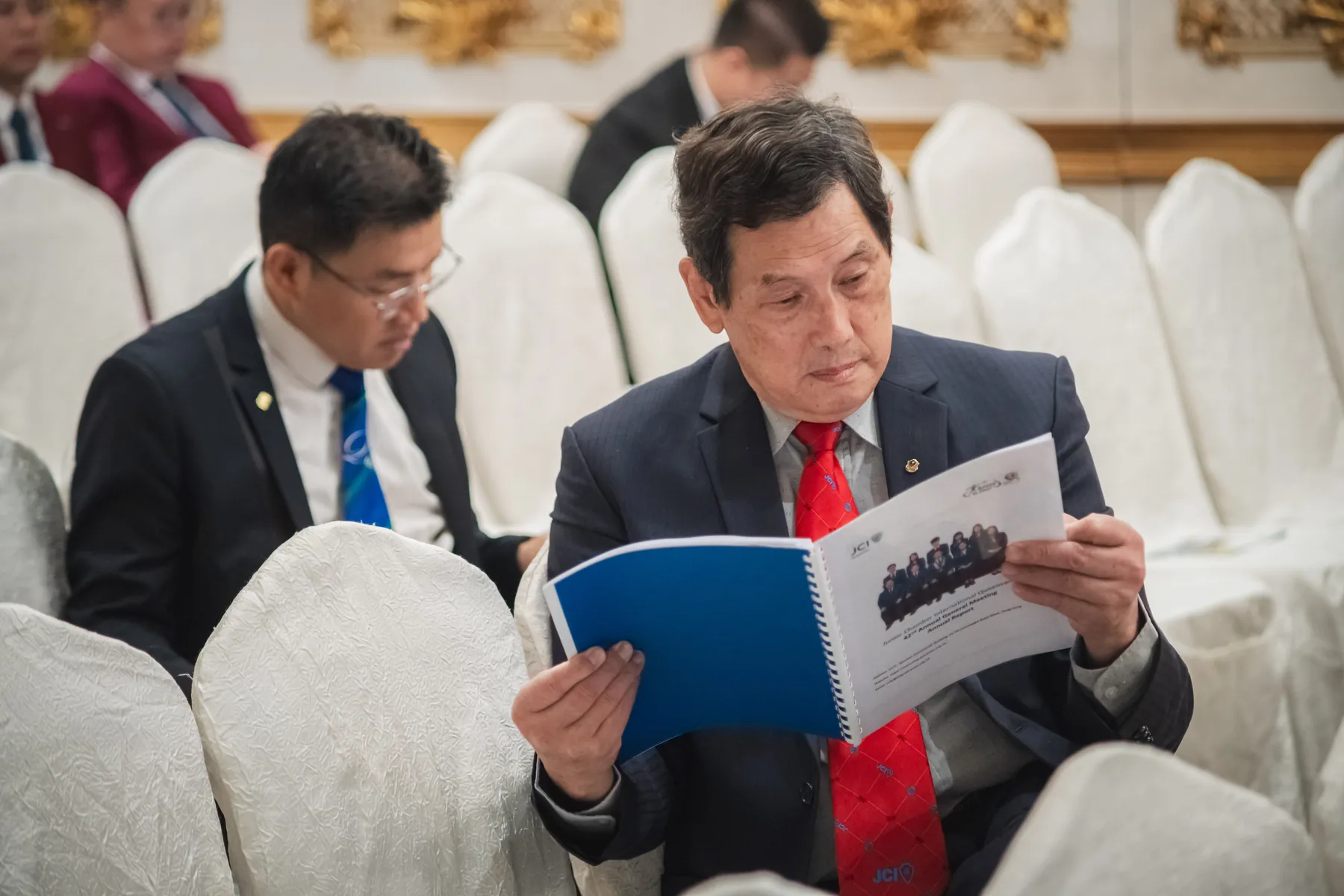 Members and guests connecting at the AGM · 65/100