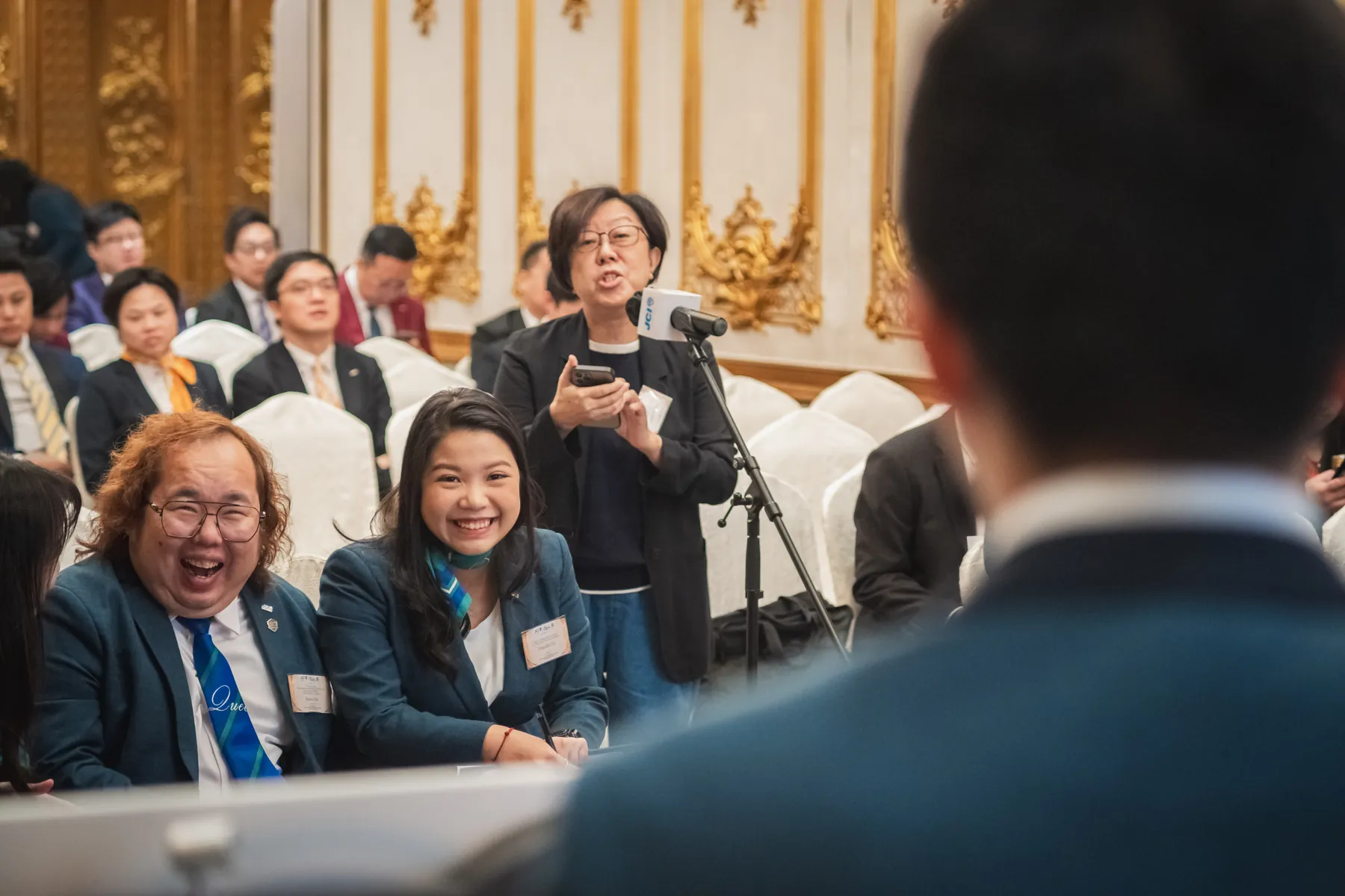Members and guests connecting at the AGM · 75/100